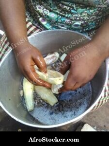 African Woman Cooking Traditional Meal