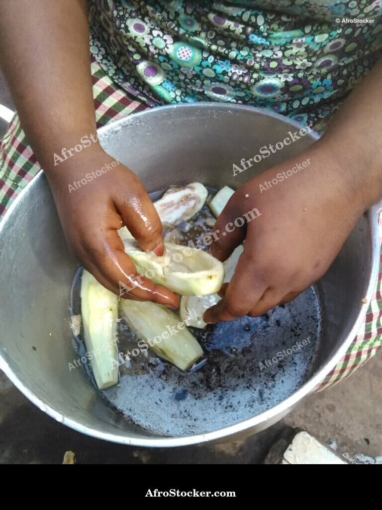 African Woman Cooking Traditional Meal - AfroStocker