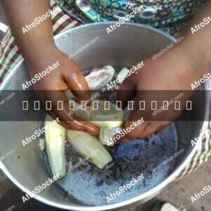 African Woman Cooking Traditional Meal - AfroStocker