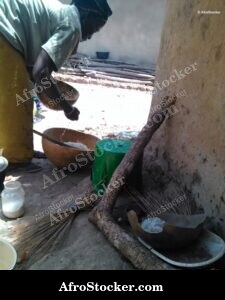 Woman Cooking in African Village