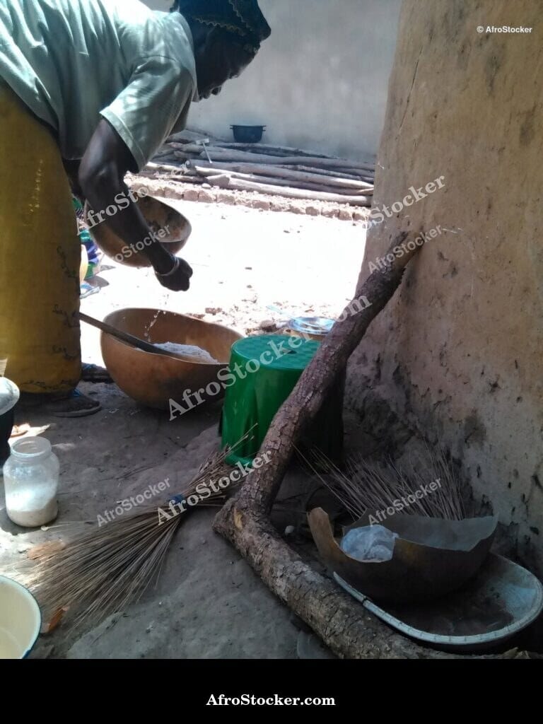 Woman Cooking in African Village - AfroStocker