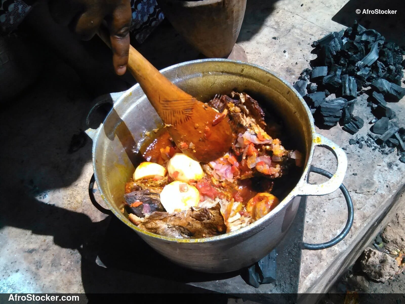 Woman Stirring Pots Over Fire, West Africa - AfroStocker