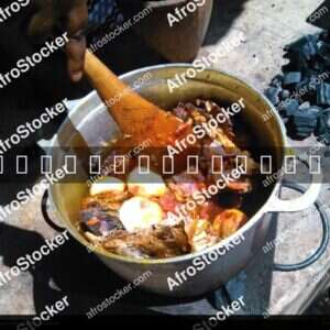 Woman Stirring Pots Over Fire, West Africa - AfroStocker