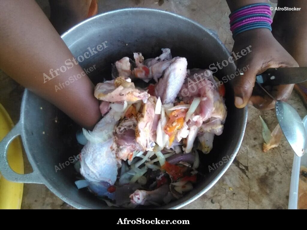 Woman Preparing Chicken Sauce, Africa - AfroStocker