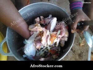 Woman Preparing Chicken Sauce, Africa