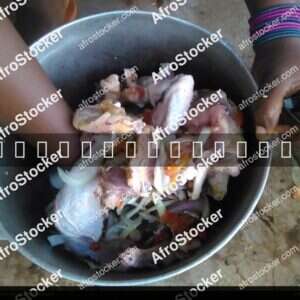 Woman Preparing Chicken Sauce, Africa - AfroStocker