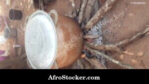 Rice Cooking in Large Pot Over Wood Fire