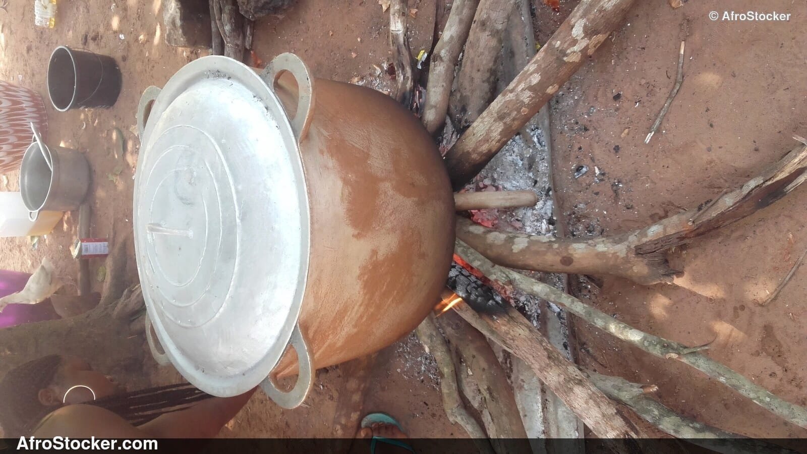 Rice Cooking in Large Pot Over Wood Fire - AfroStocker