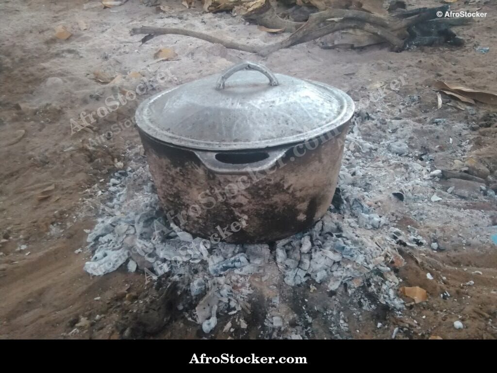 large pot wood fire african village communal