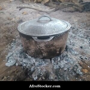 large pot wood fire african village communal