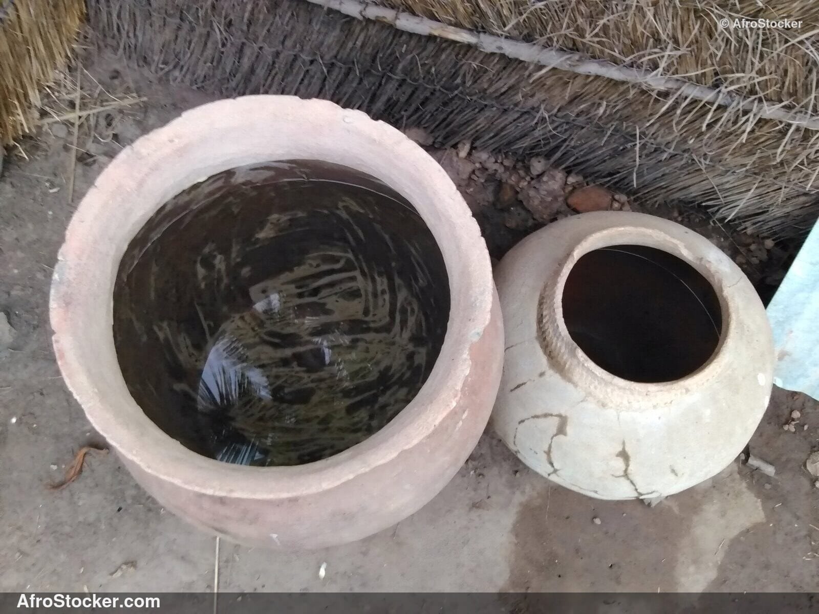 African Clay Pot Filled With Water | AfroStocker