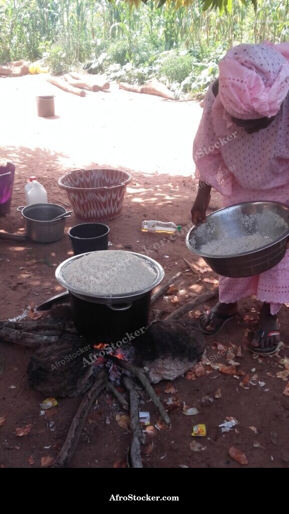 woman cooking african kitchen daily life